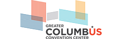 Logo for Greater Columbus Convention Center with overlapping colored rectangles and bold text. The word "COLUMBUS" highlights the letters "US" in red.