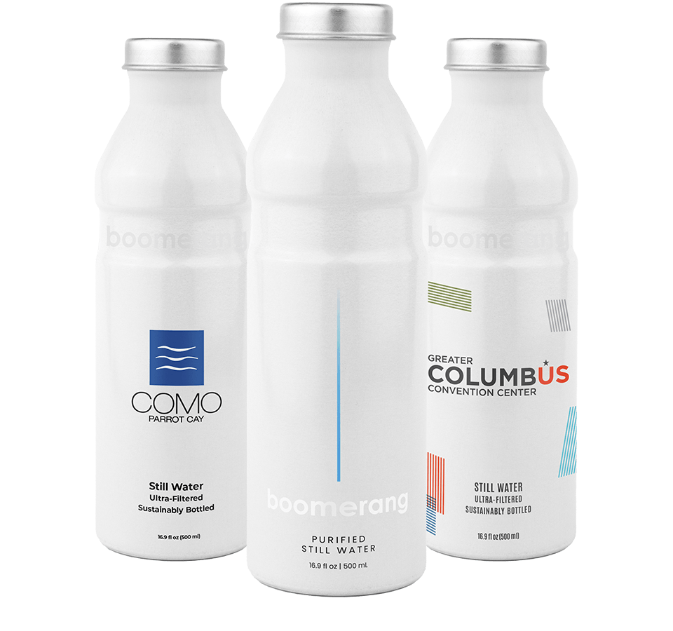 Three white reusable water bottles with different logos and text labels: "COMO PARROT CAY," "boomerang purified still water," and "GREATER COLUMBUS CONVENTION CENTER." Each has blue accents and clean, modern design.