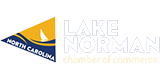 Logo for Lake Norman in North Carolina, featuring a yellow and blue triangular design with a white sailboat and text reading "Lake Norman North Carolina" in bold letters.